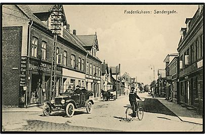 Frederikshavn. Søndergade med J.M.Rugh´s Blikkenslager og Gasvarmemester med gammel Automobil. Herluf W. Jensen u/no. 