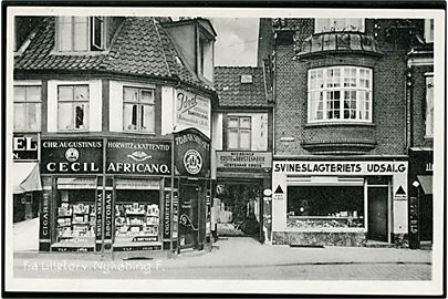 Nykøbing Falster. Fra Lilletorv med Tobakshandler, Slagter mm. Stenders no. 72092.