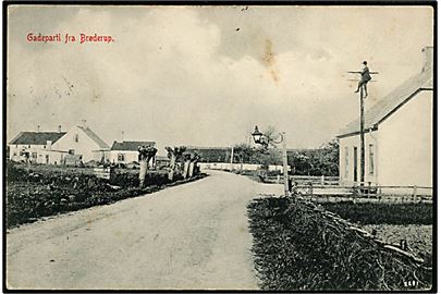 Brøderup, gadeparti med telefonmontør i telefonmast. J. Nielsen no. 2291