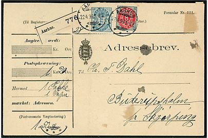 8 øre Tofarvet omv. rm. og 20 øre Våben på adressebrev for pakke fra Aarhus d. 22.4.1899 til Buderupsholm pr. Skørping. Fold og lidt nusset.