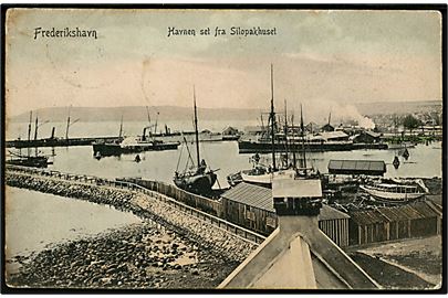 Frederikshavn, havnen set fra Silopakhus med dampskibe. P. Alstrup no. 2088. Frankeret med 10 øre Fr. VIII fra Frederikshavn d. 23.1.1908 til sømand ombord på S/S Svanholm c/o danske konsulat i Ostende, Belgien.