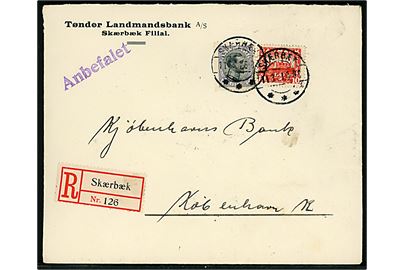 10 øre Genforening og 40 øre Chr. X på fortrykt kuvert fra Tønder Landmandsbank sendt anbefalet og annulleret med brotype IIb Skærbæk sn1 d. 11.3.1921 til København.