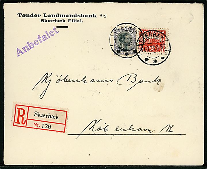 10 øre Genforening og 40 øre Chr. X på fortrykt kuvert fra Tønder Landmandsbank sendt anbefalet og annulleret med brotype IIb Skærbæk sn1 d. 11.3.1921 til København.