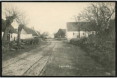 Sandby ved Holbæk. Gadeparti. J. P. K. P. Mørkøv no. 5550. Frankeret med 5 øre Chr. IX annulleret med stjernestempel SANDBY og sidestemplet bureau Nykjøbing S. - Holbæk T.8 d. 11.7.1906 til København.