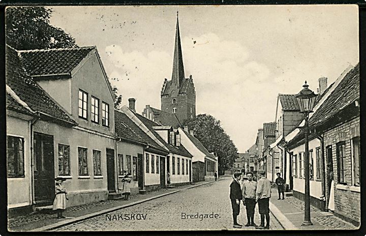 Nakskov, Bredgade. Stenders no. 12295. Frankeret med 5 øre Fr. VIII fra Nakskov d. 29.6.1908 til Østerby på Fejø. Ank.stemplet brotype Ia Fejø d. 30.6.1908.