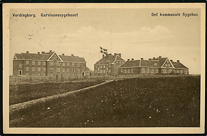 10 øre Bølgelinie på brevkort (Vordingborg, Garnisonssygehuset og det kommunale sygehus) annulleret med sjældent brotype IIa Vordingborg JB.P.E. II d. 20.9.1929 til Slagelse. Stempel benyttet ved Vordingborg Slotsstation.