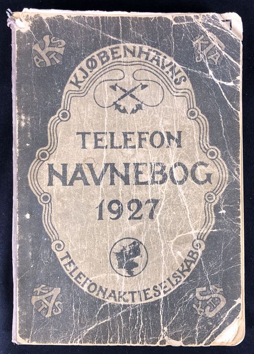 Kjøbenhavns Telefonaktieselskab Telefon Navnebog 1927. Slidt, men omfattende opslagsværk incl. reklametillæg. 