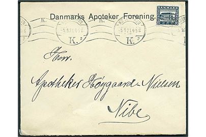 20 øre Genforening med perfin AB (Alfred Benzon) på firmakuvert fra Danmarks Apoteker Forening i København d. 5.9.1921 til Nibe.