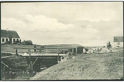 Parti fra Raageleje Fiskerby. Dreng med barnevogn på bro. Stenders no. 5855.